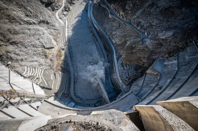 View straight down from the crest of Inguri Dam into the gorge β 271 metres, water discharge